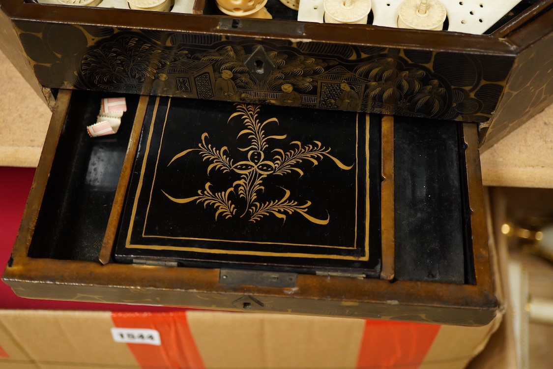 Three 19th-century Chinese gilt-decorated black lacquer sewing boxes, two containing bone sewing accessories, together with a similar tea chest (4) largest box- 33.3cm wide x 20cm high
